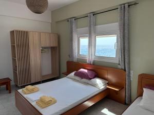 Postel nebo postele na pokoji v ubytování Voula Beach