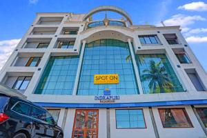 a building with a sign on the front of it at Indrapuri Rajadhani in Trivandrum