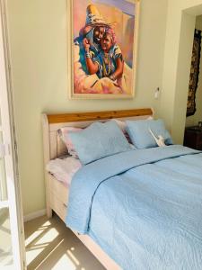 Un pat sau paturi într-o cameră la Brise des Pins