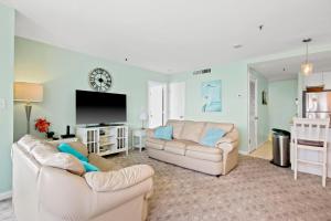 a living room with two couches and a tv at Myrtle Beach Resort T1402 in Myrtle Beach