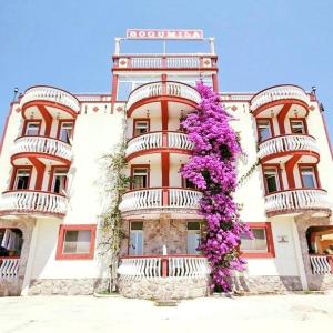 a building with a bunch of purple flowers in front of it at BOGUMILA in Bar