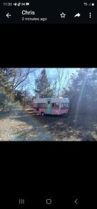 a picture of a bus parked in a field at Goin Bonanza Glamping Ranch in Hardy