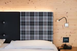 Postel nebo postele na pokoji v ubytování Hotel Piccola Baita