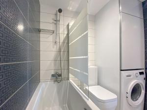 a white bathroom with a toilet and a sink at Phaedrus Living: City Flat Rafaella 6 in Nicosia