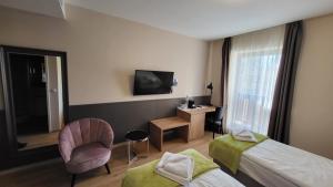 TV a/nebo společenská místnost v ubytování D50 Hotel