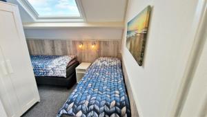 Postel nebo postele na pokoji v ubytování DCL03 modern holiday home with terrace