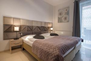 Giường trong phòng chung tại Apartamenty Feniks