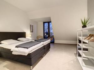 a bedroom with two beds in a room at Mooi Maaseik in Maaseik