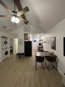 a large living room with a table and a kitchen at Cozy Carey Bay Cottages in Grove on Grand Lake in Grove