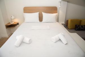 Postel nebo postele na pokoji v ubytování Syntagma View Apartment