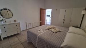 Postel nebo postele na pokoji v ubytování Apartmani Tolj