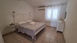 Postel nebo postele na pokoji v ubytování Apartmani Tolj