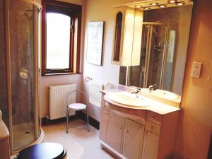 a bathroom with a sink and a shower at Collin Hill House in Castle Douglas