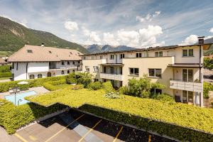 an aerial view of a building with a yard at Garden Residence in Lana