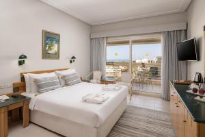 A bed or beds in a room at Sindbad Club