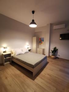 Ένα ή περισσότερα κρεβάτια σε δωμάτιο στο Villa Elea Apartments
