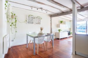 a dining room with a table and chairs at IZARO Best View in Bermeo