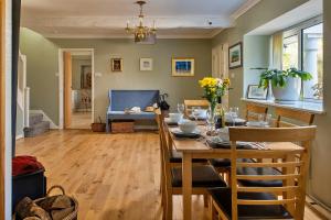 a dining room with a table and chairs in a room at Finest Retreats - Felin Ship in Dolgellau +37 photos