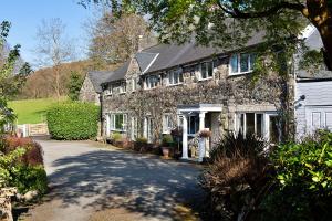a large stone house with a driveway at Finest Retreats - Felin Ship in Dolgellau