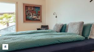 Ein Bett oder Betten in einem Zimmer der Unterkunft Casa Teatro Panoramico 5 Star Holiday House