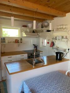 a kitchen with a sink and a counter top at Sun Slottet in Stockholm