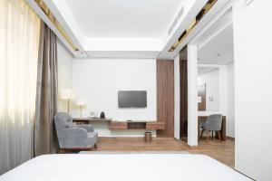 Телевизор и/или развлекательный центр в AKASIYA HOTEL