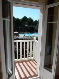 Balkon lub taras w obiekcie Maison NAUCALA proche de la piscine