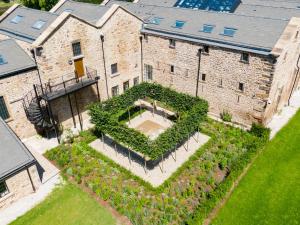 an aerial view of a garden in front of a building at Theodore House in Clitheroe