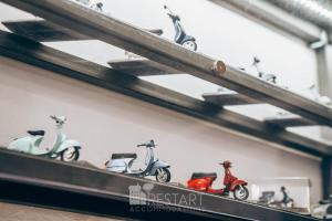 a row of scooters sitting on a shelf at Restart Accommodations Balestra in Rome