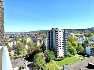 an aerial view of a city with buildings at Little Penthouse **** in Dietikon