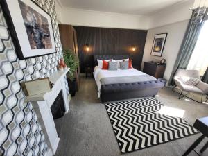 Tempat tidur dalam kamar di Belle Vue Guest House