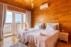 Krevet ili kreveti u jedinici u objektu Lucida Villas - Kalkan Hills - Villas with Panaromic Sea View and Private Pool