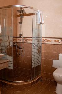 a shower stall in a bathroom with a toilet at Jermuk Ararat Health SPA in Jermuk