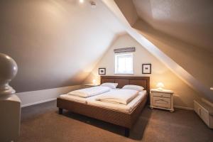 Postel nebo postele na pokoji v ubytování Taal-Huis-1b