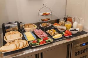 a table with different types of food on it at Belle Boutique in Sliema