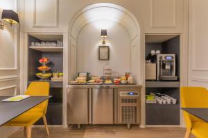 a kitchen with a counter with food on it at Belle Boutique in Sliema