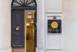 a door to a building with a sign on it at Belle Boutique in Sliema