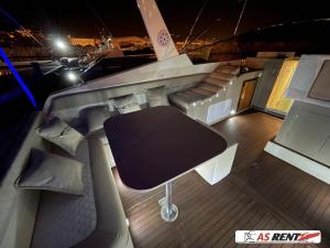 a table on the back of a boat at night at AIR OF SEA ON BOAT in Salerno