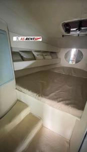 a room with several beds and a window in a vehicle at AIR OF SEA ON BOAT in Salerno