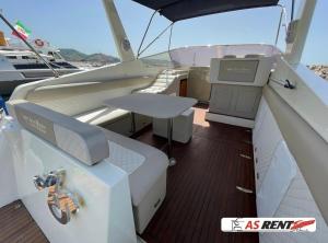 a seat on a boat with a table on the deck at AIR OF SEA ON BOAT in Salerno