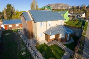 an aerial view of a house with a metal roof at Apartamentos Matices in El Calafate