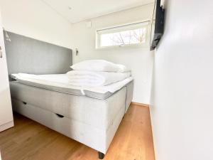 Postel nebo postele na pokoji v ubytování Kostergården