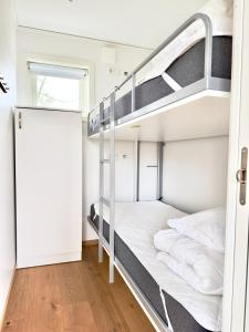 a bunk bed room with two bunk beds at Kostergården in Sydkoster