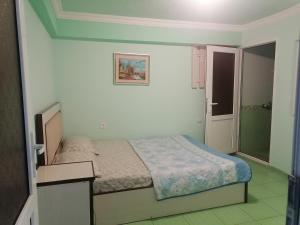 Una cama o camas en una habitación de Hotel Xachen