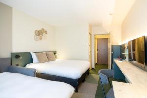 Postel nebo postele na pokoji v ubytování Green Park Hotel Brugge