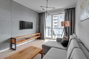 Telewizja i/lub zestaw kina domowego w obiekcie Apartamenty "Bastion Wałowa'' Q4Apartments