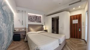 Postel nebo postele na pokoji v ubytování Hotel La Serena
