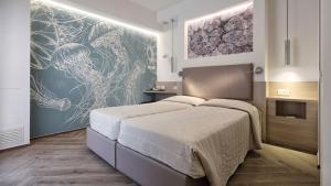 Postel nebo postele na pokoji v ubytování Hotel La Serena