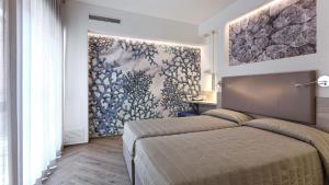 Postel nebo postele na pokoji v ubytování Hotel La Serena