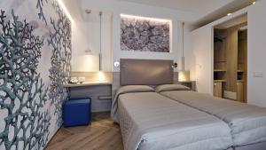Postel nebo postele na pokoji v ubytování Hotel La Serena